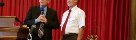 Jim Buchanan (right), pastor of the Cumberland/Frostburg church district, welcomes Don Kelly, a former Mormon, as the newest member of the Frostburg church.