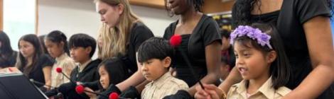 La Sonnette members Meagan Nims, Harmony John and Jairine Almeida teach young students how to play the bells in South Korea.