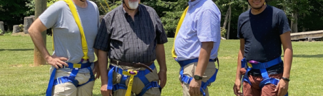 Bob Cundiff, Ohio Conference president; Tim Bailey, Mountain View Conference (MVC) president; Marcellus T. Robinson, Columbia Union Conference president; and Walter Cardenas, assistant to the MVC president, prepare for the ropes course.