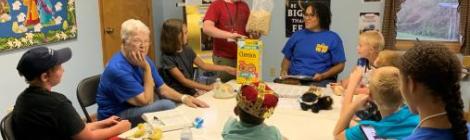 VBS leaders (in blue) teach about the character traits—truth and trusting—that Daniel and his friends relied on in Babylon.