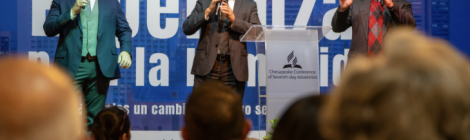 Musical trio Adoración sin Límites leads worship at a Spanish-speaking evangelistic meeting in Baltimore.