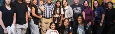 Rich Aguilera (pictured in hat), founder of One Mustard Seed, is flanked by Children’s Festival attendees.
