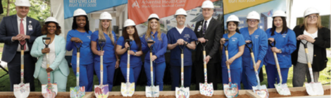 Nurses and other team members representing units and services within the new tower joined Adventist HealthCare President and CEO Terry Forde and hospital President Dan Cochran for the first dig.
