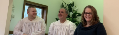 Tyler Roberts, Pastor Fred Shoemaker and Jessica Halye celebrate Roberts' baptism and Halye’s profession of faith at the Wilmington church.