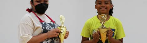 Fourth-grader Lukas McLean (right) and seventh-grader Illiana Simons win first prize in their respective age groups during the "Kids in the Kitchen" contest 
