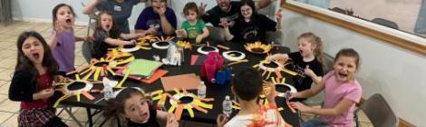 Kids and staff roar like a lion during a craft activity at Shamokin church’s LEGIT summer camp.