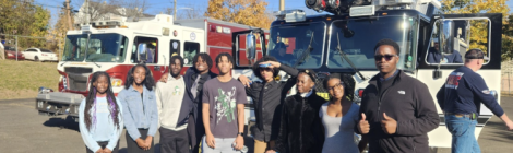 Nathan Henry (right) and other PFA students prepare to explore the inside of fire trucks during the “Childrens’ Story Hour,” hosted by the Walnut Street Community church.
