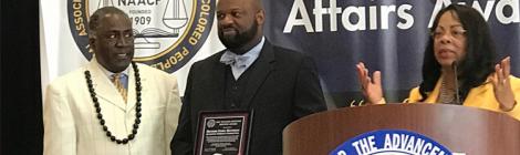 Richard Matthews (center) receives a NAACP award.