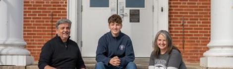 The Williams’ Family—Tony (’82), Theron (’27) and Tracey—share a moment in front of the boys’ dorm.
