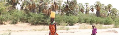Woman and child walk miles to ferry water. Photo: © 2021 ADRA | Horn of Africa
