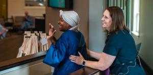 Heather Crews (right), pastor of the Courthouse Road church, baptizes Melissa Winn, who first attended a Christian movie night, one of many events the church hosts to introduce guests to Christ.