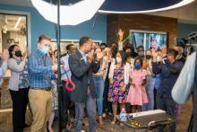 WGTS listeners and staff cheer as the new station goes live