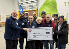 At the "Food 4 Families" event, the John C. Flood team grants ACSGW $3,000 to assist a family who was in need of HVAC services.
