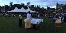 Dillon Smith, 12, speaking to about 1,000 people at a park in Karongi, Rwanda, on Sunday evening. (Jackie O. Smith) via Adventist Review