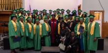 Speker Antoine (center), guest speaker at the Bethel French church’s inaugural promotion service, is flanked by the graduates, pastor and church leaders. Bethel French Graduates 32 at Promotion Service, Bethel French church, Allegheny East Conference, Speker Antoine, Abdonel Jean Philippe, Voice of Hope