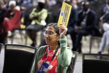 Leena Moses, a young adult delegate from the Potomac Conference, participates in the voting process during the General Conference Session. Photo by Nathaniel Reid/AME (CC BY 4.0)