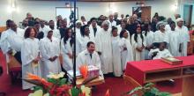 Candidates prepare to be baptized at the Glenville Present Truth church in Cleveland. 