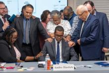 The Chesapeake Conference Executive Committee prays for Andre Hastick following his election. Photo by Melvin Donadelle The Chesapeake Conference Executive Committee prays for Andre Hastick following his election. Photo by Melvin Donadelle