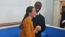 Enock Bouzy, lay pastor of the Collingwood Park church, baptizes a woman during the fall evangelism initiative.