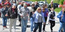 William Levin (middle with cap), pastor of Akron First, and his wife, Jan, lead their church members in the "Walk to Stop Hunger" campaign
