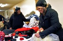 Mt. Olivet members sort clothes for homeless individuals, as the church became a Code Blue winter station due to the freezing tempartures.