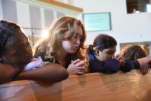 Highland View Academy students pray during a week of prayer. 