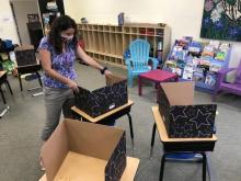 A teacher at Mt. Aetna Adventist School prepares her classroom for the upcoming year. 