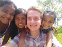 Student missionary Nathan Moravetz hangs out with three church friends in Yap.