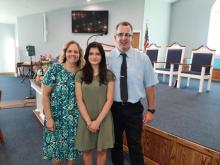 Lauri and Joe Nichols came to know Christ as a result of Rachel Velez (center), a 14-year-old who couldn't hide her love for Jesus.