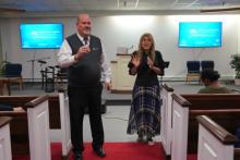 Speaker Ron Lynch from LIGHT talks about the benefits of health training, interpreted into Spanish by Rossana Benavides, a Hackettstown church member.