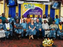 Bob Cundiff, Ohio Conference president, and his wife, Tanique (center), join Columbus Ghanaian church pastors and guests during its 25th year celebration.