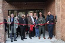 Dave Pate, project manager; Shaun Lazarus, school principal; Rick Bianco, conference education superintendent; Katie Swackhamer, school board chairperson; Kojo Twumasi, Toledo First church pastor; and Bob Cundiff, conference president, take part in the ribbon-cutting ceremony