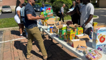 Volunteers distribute food at an ACS site hosted by Berean Seventh-day Adventist Church in St. Louis, supporting residents impacted by the May 16 EF-3 tornado. Photo courtesy of Outlook magazine | Mid-America Union