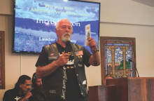 Richard “Cowboy” Smith, a member of the Point Pleasant church in W.Va., shares about the Three Angels’ Messengers Motorcycle Association during the special Biker Sabbath at the Toll Gate church.