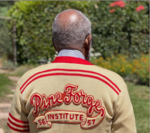 Everard Williams (’57) proudly wears his vintage class sweater at the reunion.