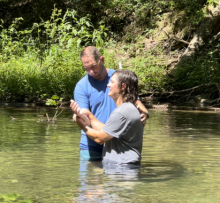 Matthew Haire, pastor of the Morgantown (W.Va.) church, baptizes Alan Ayala at the New Believer’s retreat.