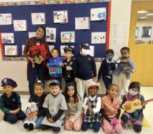 Elementary students express their individuality and creativity by dressing in attire that represent their desired future careers, pictured with kindergarten teacher Lynette Sigh.