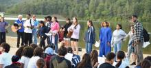 Zaida Galva (in robe) and her friends lead students in praise and worship during the baptismal celebration.