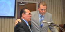 José H. Cortés Sr. and Dave Weigley pray together during a Columbia Union Conference Executive Committee meeting.