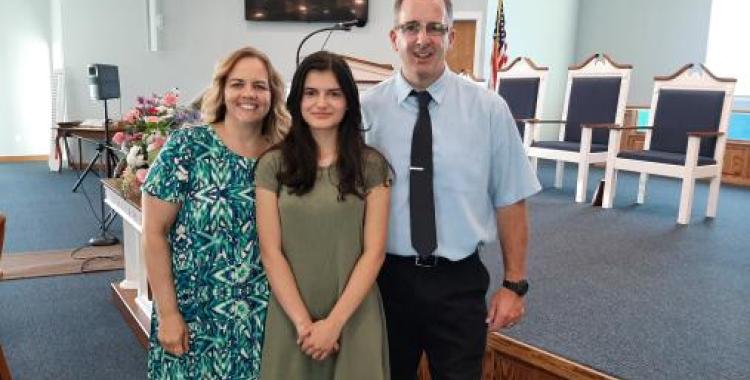Lauri and Joe Nichols came to know Christ as a result of Rachel Velez (center), a 14-year-old who couldn't hide her love for Jesus.