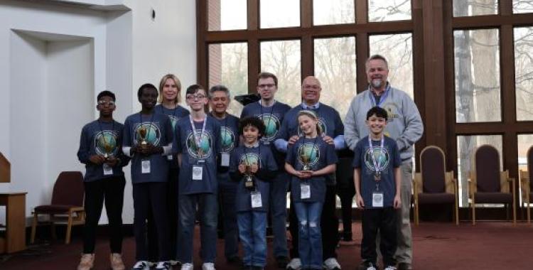 Geography Challenge winners proudly stand with Ohio Conference staff members.
