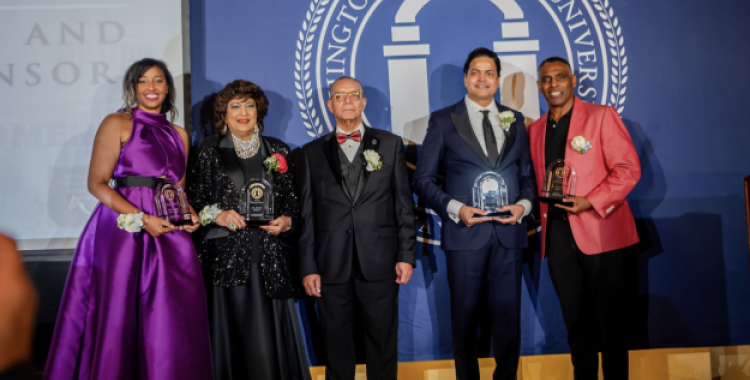 Dr. Weymouth Spence, WAU president, is flanked by the four honorees who were awarded for their service in action during the 12th Annual Visionaries Gala. 