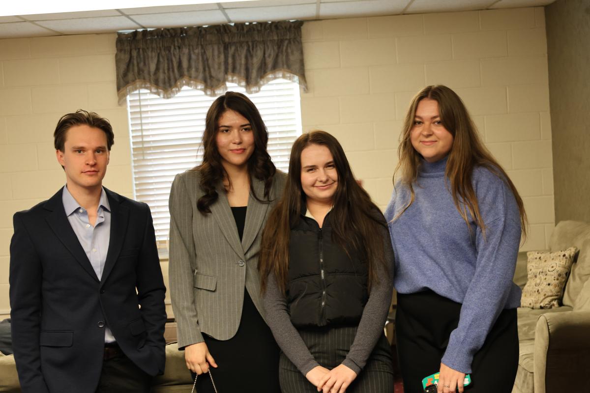 Two Russians, left and right with 2 Ukrainian  girls in the middle at a Sabbath School class