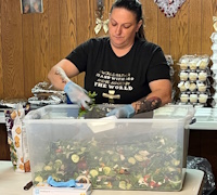 Member Betsy Hancock makes a salad for her church neighbors.