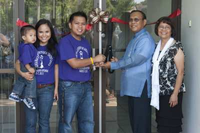 The new pastoral leadership and former pastor take a moment to enjoy the official opening of the new Virginia Beach church building.  From left, Marco Sigue, Marifel Sigue, Pastor Mark Sigue, former Pastor Abbey Reyes and Angelina Reyes.