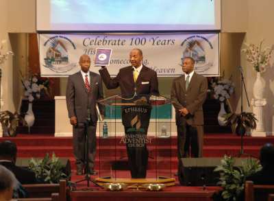 Donald Burden (center), Ephesus pastor, leads the anniversary celebration on Sabbath morning.